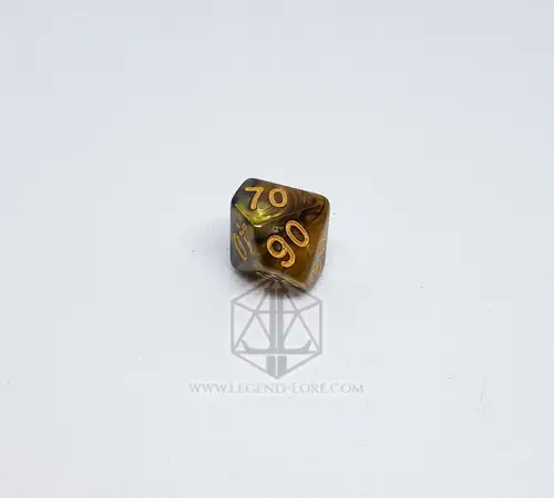 Dado D10 percentuale Ashes of War marmorizzato nero e oro con numeri dorati 70 e 90, su superficie bianca