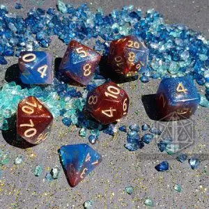 Set di sette dadi GDR Fiery Gas Planet in resina galaxy blu e rossa con numeri dorati, tra frammenti di vetro blu