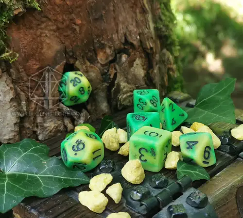 Infested Pond - RPG Dice Set 2 Infested Pond RPG dice set, seven green and yellow opaque dice with black numbers on a tree stump with ivy and pebbles