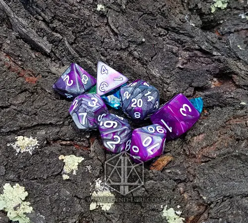 Steel Flowers set of seven polyhedral dice in swirled purple and grey with white numbers on tree bark