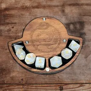 RPG ACCESSORIES - EN 9 Air Platform RPG dice coaster in wood with engraved air swirl symbol, holding seven pearly white dice with gold numbers