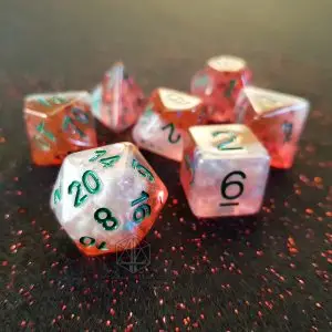 Snowy Dawn set of seven semi-transparent red and white polyhedral dice with green numbers on a red glitter surface