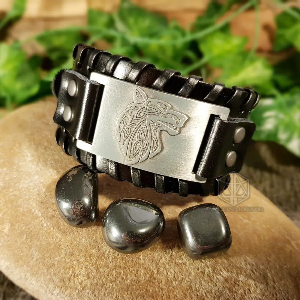Bracelet of the Pack, black woven leather cuff with silver plate engraved with a Celtic knot wolf head, beside hematite stones