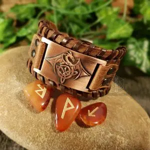 Ancient Draconic Protection Viking bracelet, brown laced leather with copper plate showing a Celtic knot dragon, beside carnelian runes