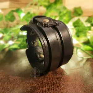 Dark Oath Viking bracelet, wide black leather cuff with layered straps, stitched loop and brass snap buttons