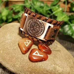 Ancient Vegvisir Viking Leather Bracelet, brown laced leather with copper Vegvisir rune plate, on a stone with carnelian runes