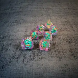 PERRY the Duck resin dice set: seven clear pink-edged dice with teal duck inclusions and orange numbers on grey fabric