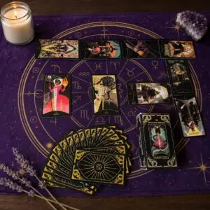 The Dungeons Dragons Tarot deck with box, black and gold card backs and illustrated cards on a purple zodiac cloth
